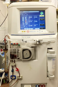 A hemodialysis has a central screen and many tubes carrying blood that function like a kidney.