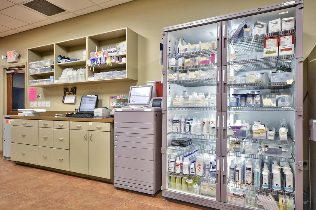 Hospital shelves stocked with supplies and medication
