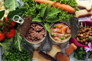 Canned dog food with vegetables.