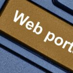 Button on computer says "web portal"