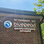 Brick building with signs that read BluePearl Specialty and Emergency Pet Hospital and Pet Emergency 24-7