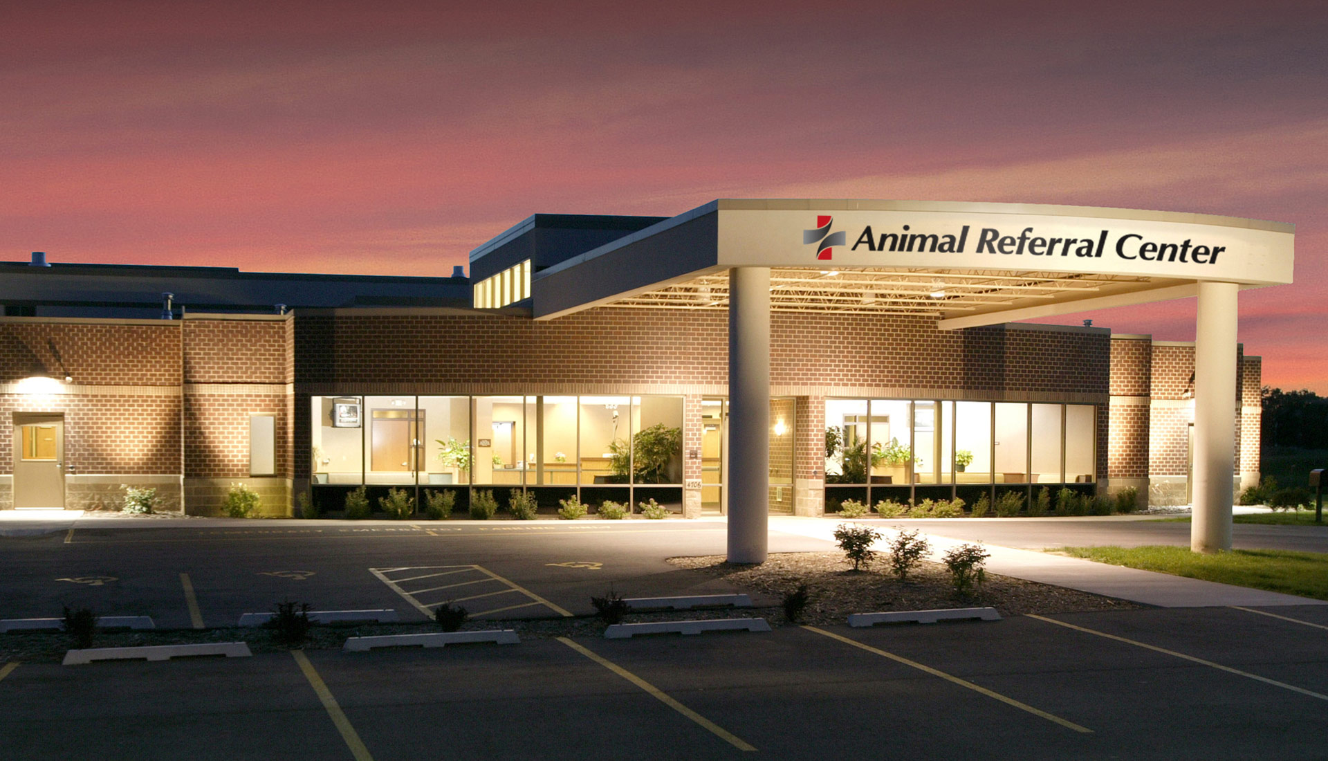 The entrance to the Fox Valley Animal Hospital is well lit and has lots of windows.