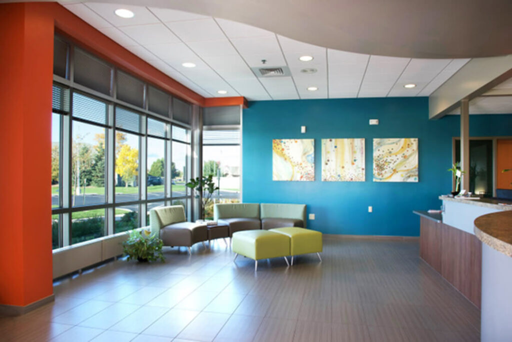 Bright colors and many windows complete the hospital lobby.