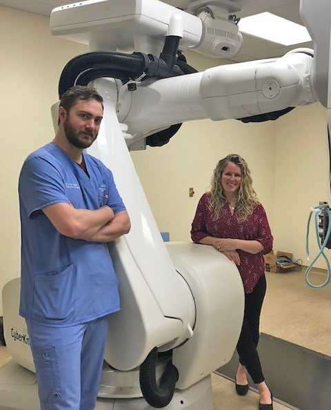 Clinicians with the Cyberknife equipment at the BluePearl Veterinary CyberKnife Cancer Center