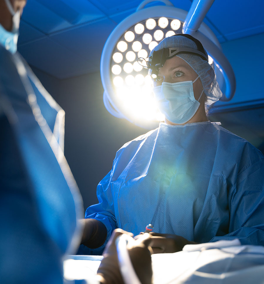 Bri Miniter, MVB, DACVS-SA, performs surgery alongside Yeniree Denis and Alirirs Loperena