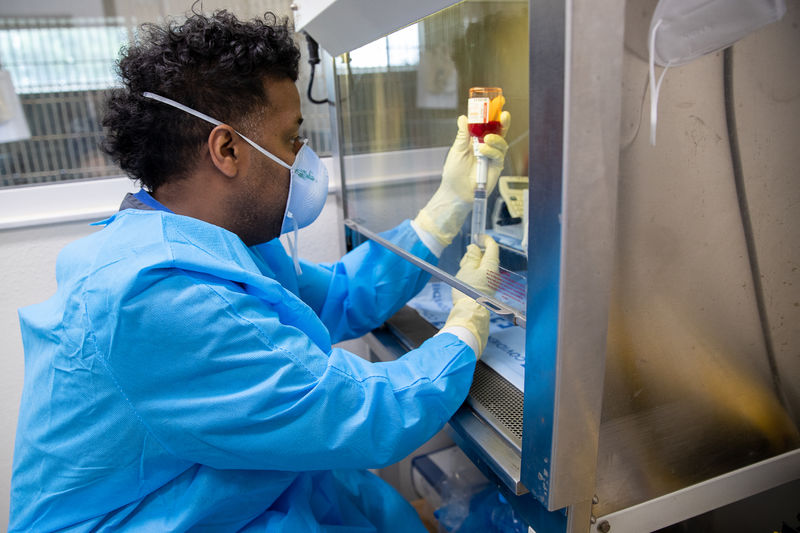 An oncology vet tech prepares medication to be used for chemotherapy.