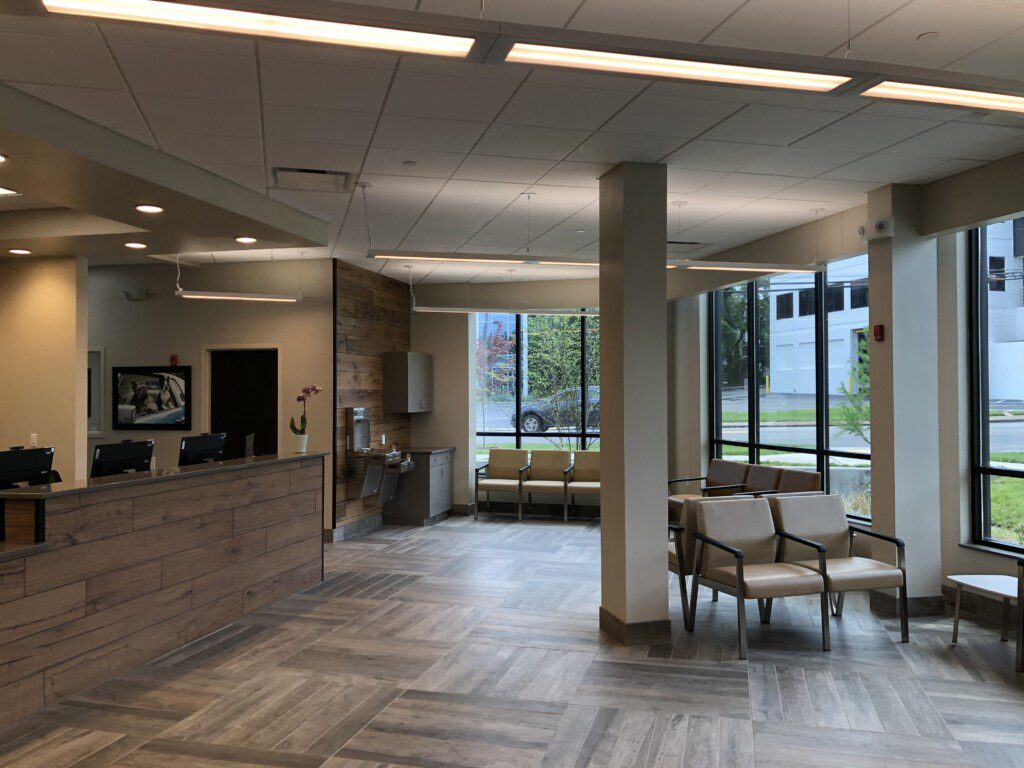 A view of the reception area, including the desk and front doors of the BluePearl Pet Hospital in Nashville.