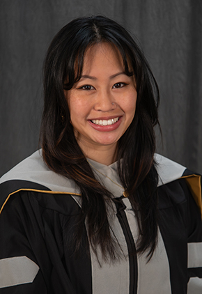 Dr. Sarah Nguyentran smiling for a graduation portrait. She has on her black doctoral robe and stole.