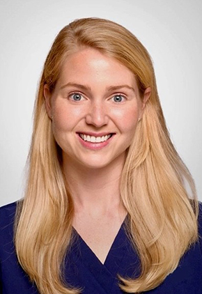 Dr. Katherine Durán smiles for a professional headshot. She is wearing navy scrubs.