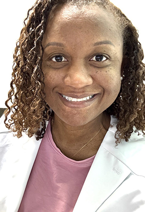 Dr. Candice Bailey smiles for a headshot. She is wearing a mauve blouse and her whitecoat.