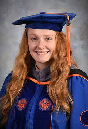Dr. Katherine Alison Green smiles for her graduation photo in her University of Florida doctoral regalia.